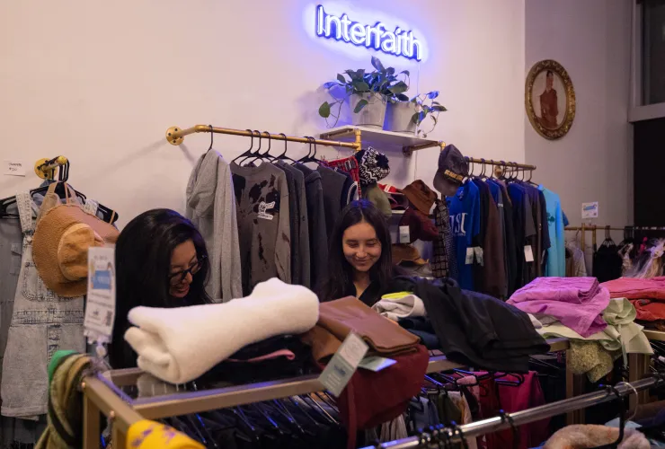 Mother and daughter browsing clothing together