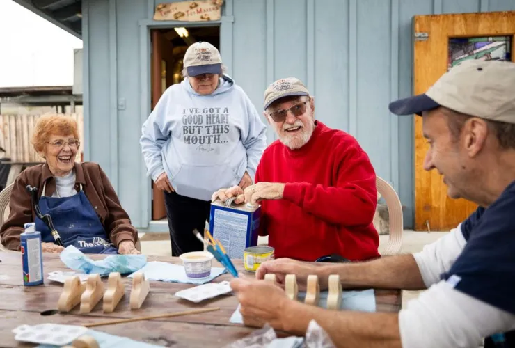 The toys are the classics, with no batteries required — wooden baby carriag...