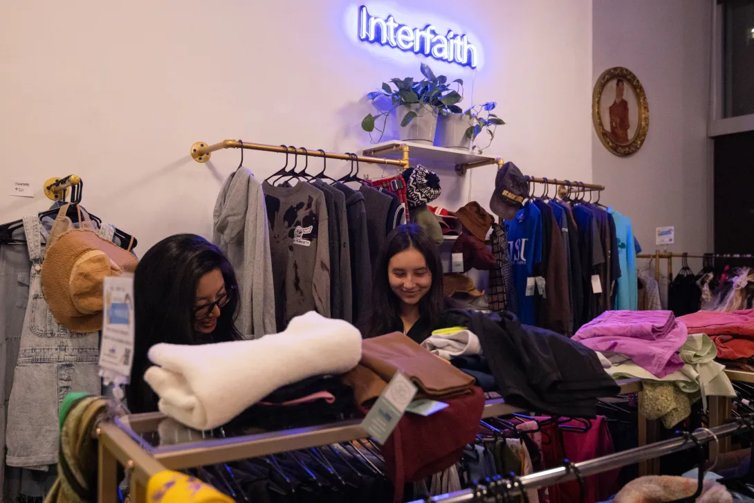 Mother and daughter browsing clothing together